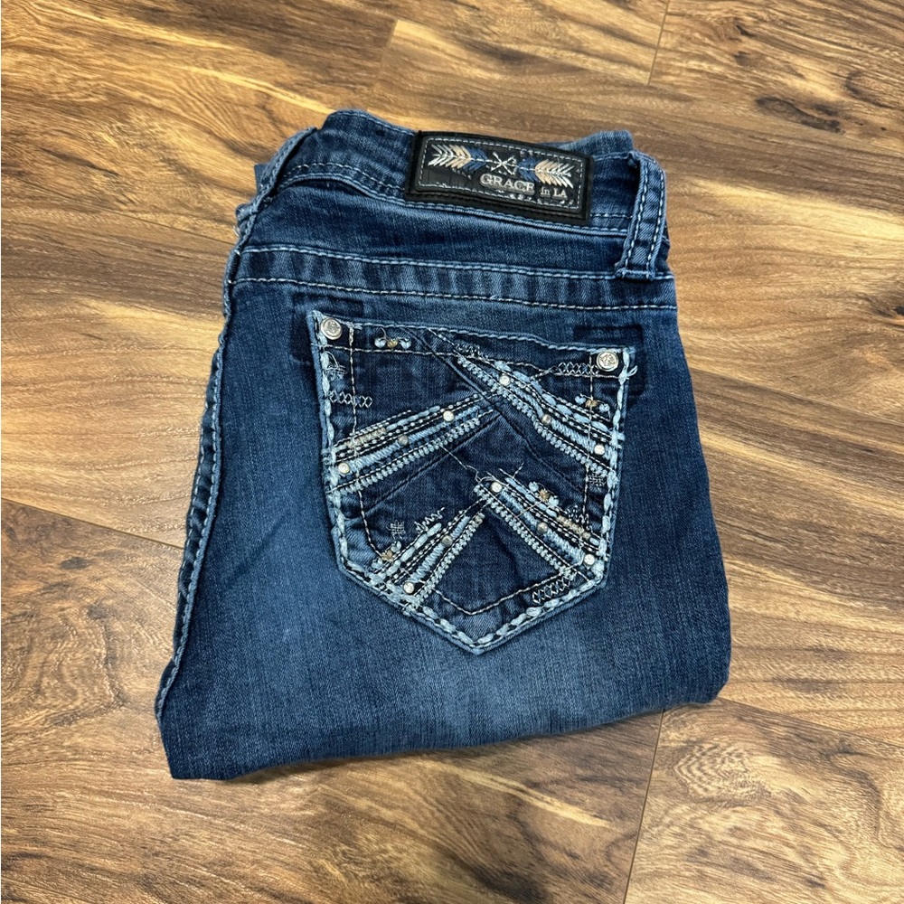 Women’s size 25 grace jeans boot cut and have a stain on the knee